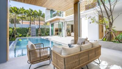 Modern outdoor living area with pool and seating