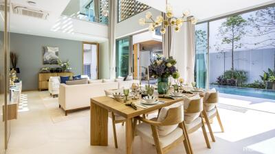 Modern living and dining area with pool view