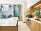 Modern kitchen with island and pool view