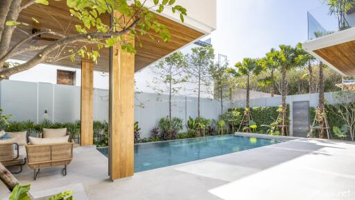 Luxury outdoor space with pool and seating area