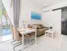 Modern living room with dining area and view of the pool