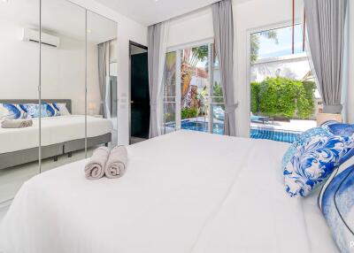 Bright bedroom with pool view