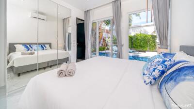 Bright bedroom with pool view