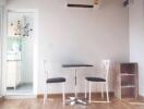 Minimalist dining area with a small table and two chairs