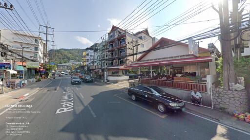 Street view of residential and commercial buildings