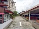 Exterior view of buildings and pathway with restaurant