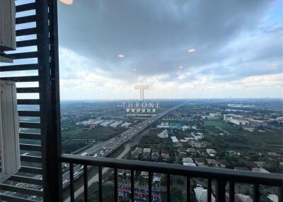 View from balcony overlooking highway and residential area