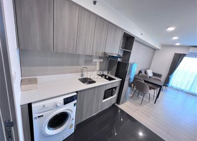 Modern kitchen with appliances and adjacent dining area