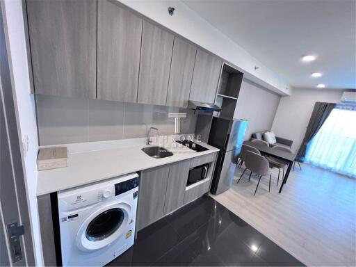 Modern kitchen with appliances and adjacent dining area