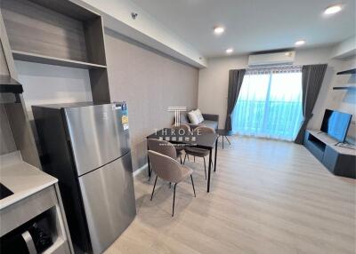 Modern living space with kitchen and dining area