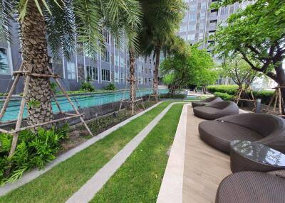 Outdoor seating area with pool view