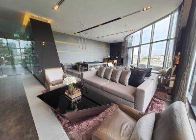 Modern living room with large windows and stylish furniture