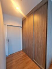 Hallway with wooden floor and built-in wardrobe