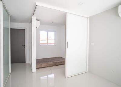 Minimalist bedroom with large sliding glass door