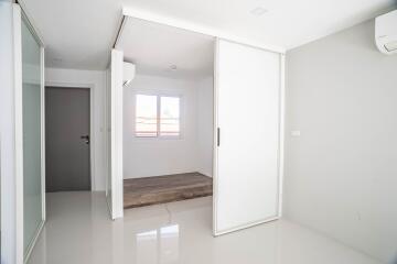 Minimalist bedroom with large sliding glass door