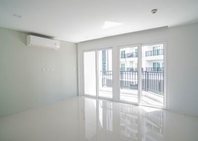 Living room with large windows and balcony access