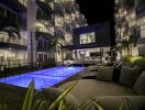 Night view of apartment buildings with illuminated swimming pool