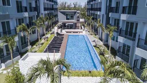 Outdoor pool area with surrounding buildings