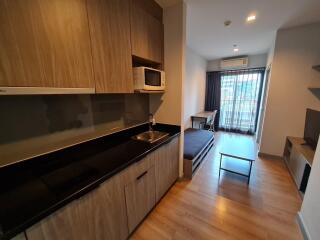 Modern Living Space with Kitchenette and Study Area