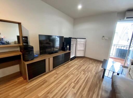 Modern living room with TV and wooden floor