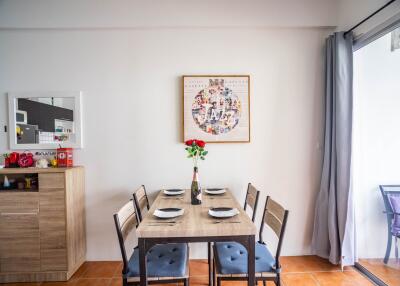 Modern dining area with wooden furniture and decorative elements