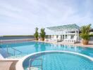 Outdoor swimming pool with lounge chairs and shaded area