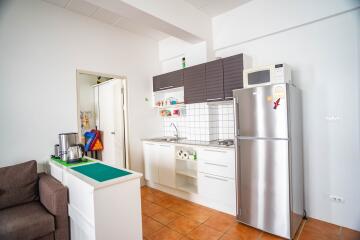 Compact kitchen with modern appliances and minimalistic design