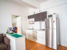 Compact kitchen with modern appliances and minimalistic design