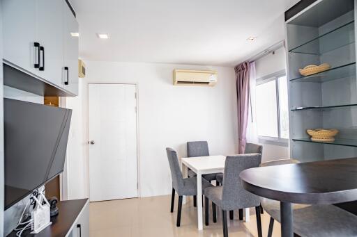 Modern dining area with glass shelves and AC