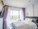 Modern bedroom with balcony and ample natural light