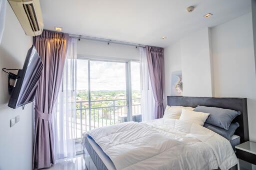 Modern bedroom with balcony and ample natural light