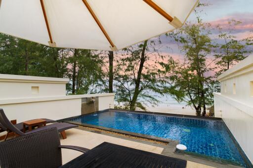 Outdoor area with pool and beach view