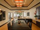 Spacious and well-lit living room with modern decor and a view of the outside patio