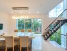 Modern dining room with glass table and pendant lights