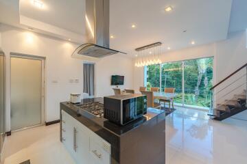 Modern kitchen and dining area with island and appliances