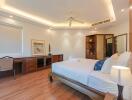 A well-lit bedroom with modern decor and amenities