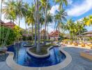 Outdoor area with pool surrounded by palm trees and lounge chairs