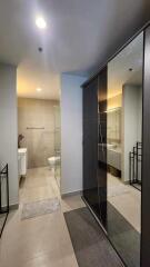 Modern bathroom with large mirror and glass shower enclosure