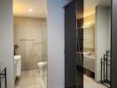 Modern bathroom with large mirror and glass shower enclosure