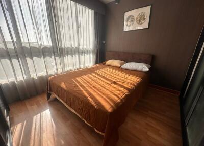 Bedroom with a large window