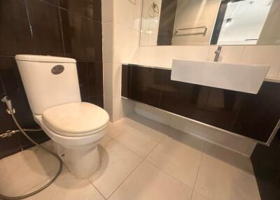 Modern bathroom with toilet and vanity