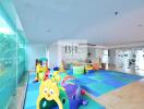 Bright children's playroom with colorful soft play equipment and natural light