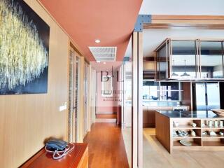 Modern hallway leading to an open kitchen area