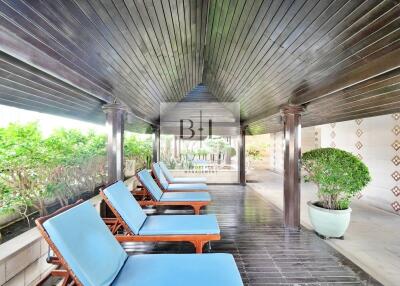 Covered patio area with lounge chairs