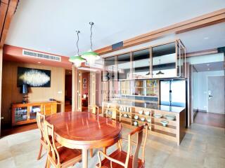 Stylish dining room with wooden furniture and modern lighting