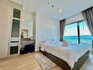 Bedroom with a large window and sea view