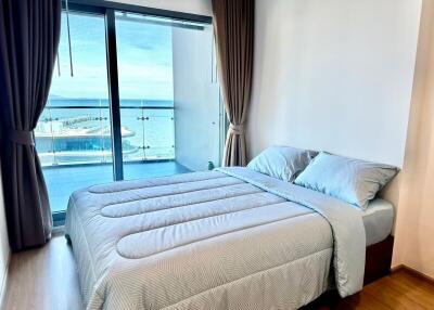 Modern bedroom with ocean view and balcony