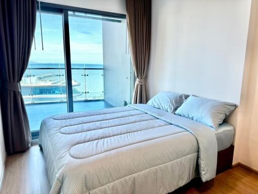 Modern bedroom with ocean view and balcony