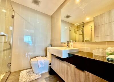 Modern bathroom with large mirror and shower