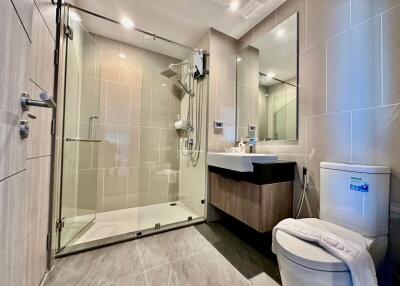 Modern bathroom with glass-enclosed shower and vanity